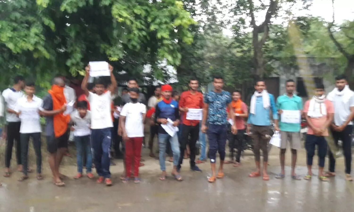 youth performing in the rain