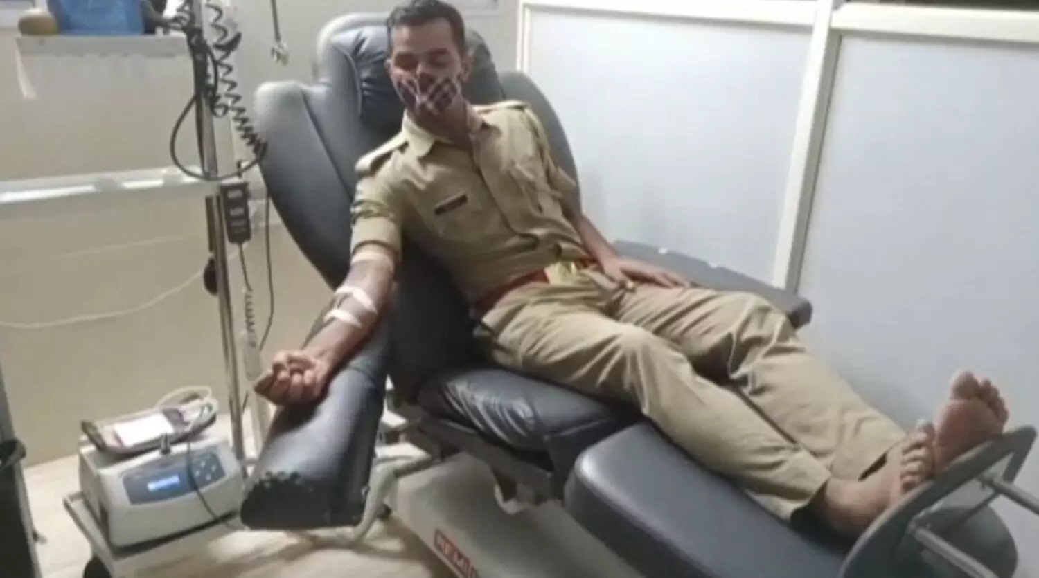 policeman donating blood