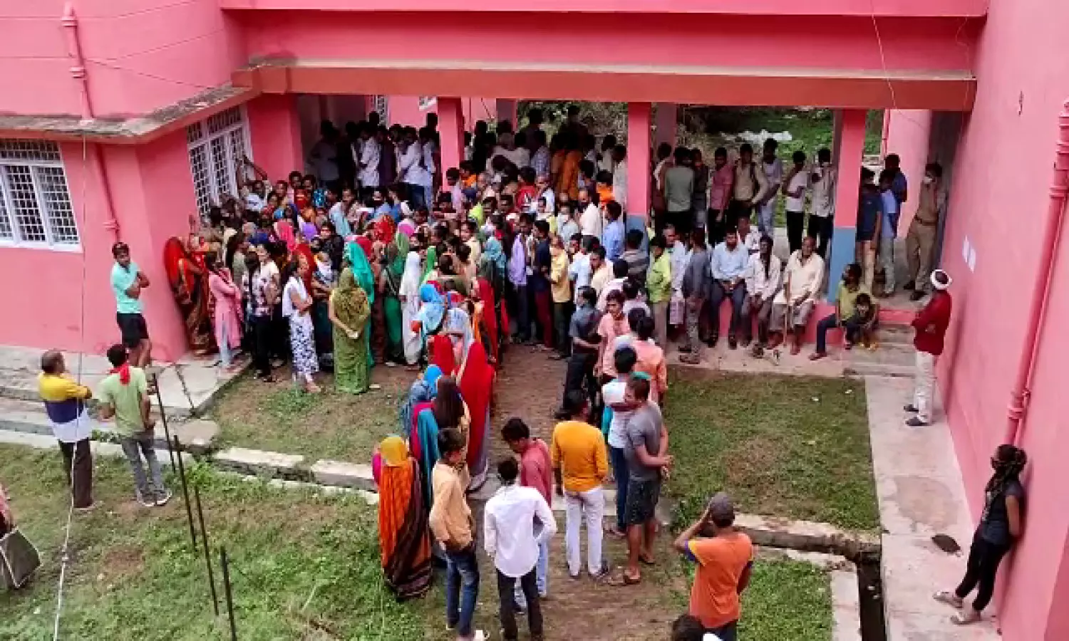 People in queue to take vaccine