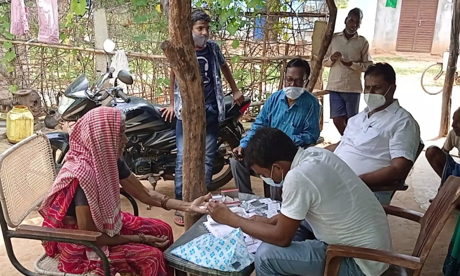 Health worker collecting blood sample