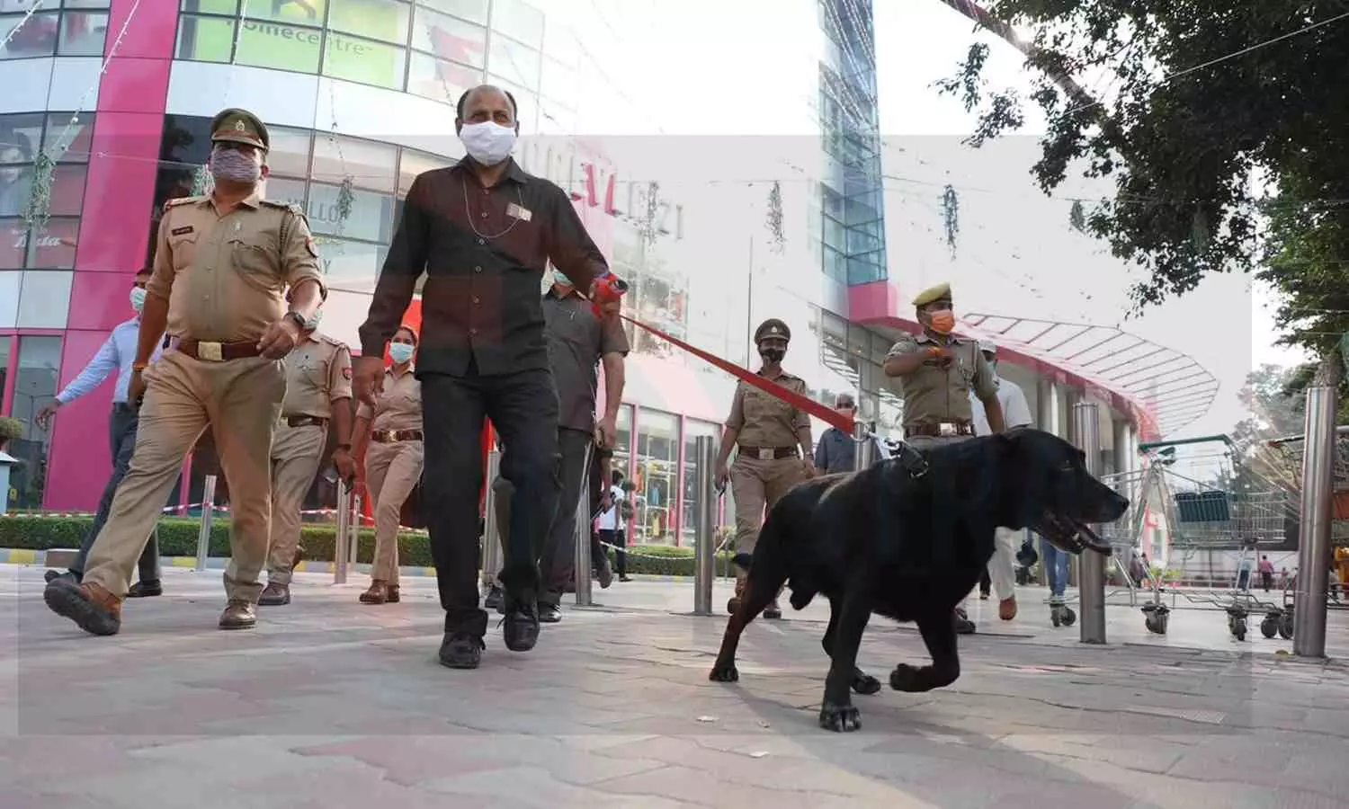 Policeman and dog squad team checking Sahara Mall