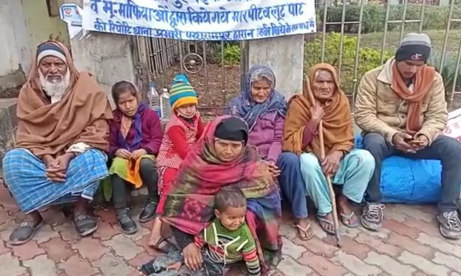family sitting on a dharna in front of the DM office for not taking action on dabangg
