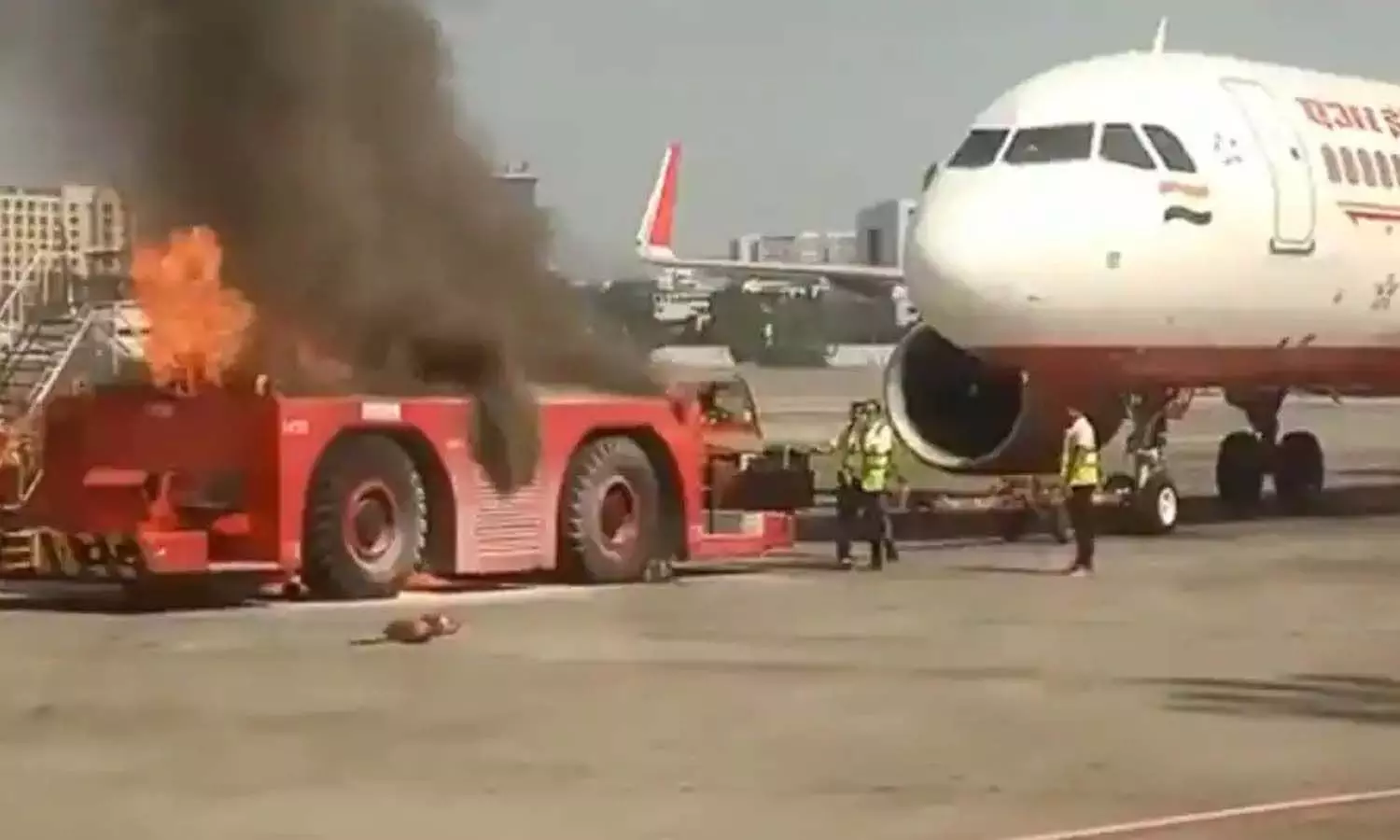 Fire in tractor parked in front of Mumbai airport plane