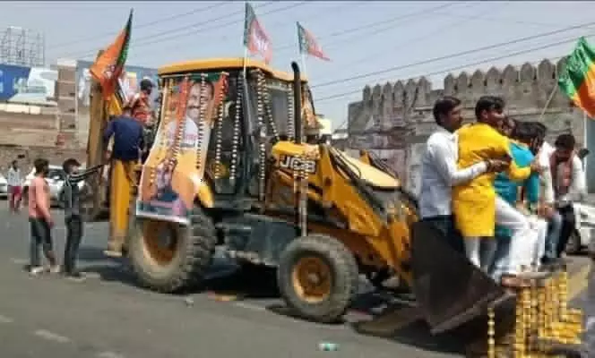 BJP leaders arrived to file nomination riding on bulldozer