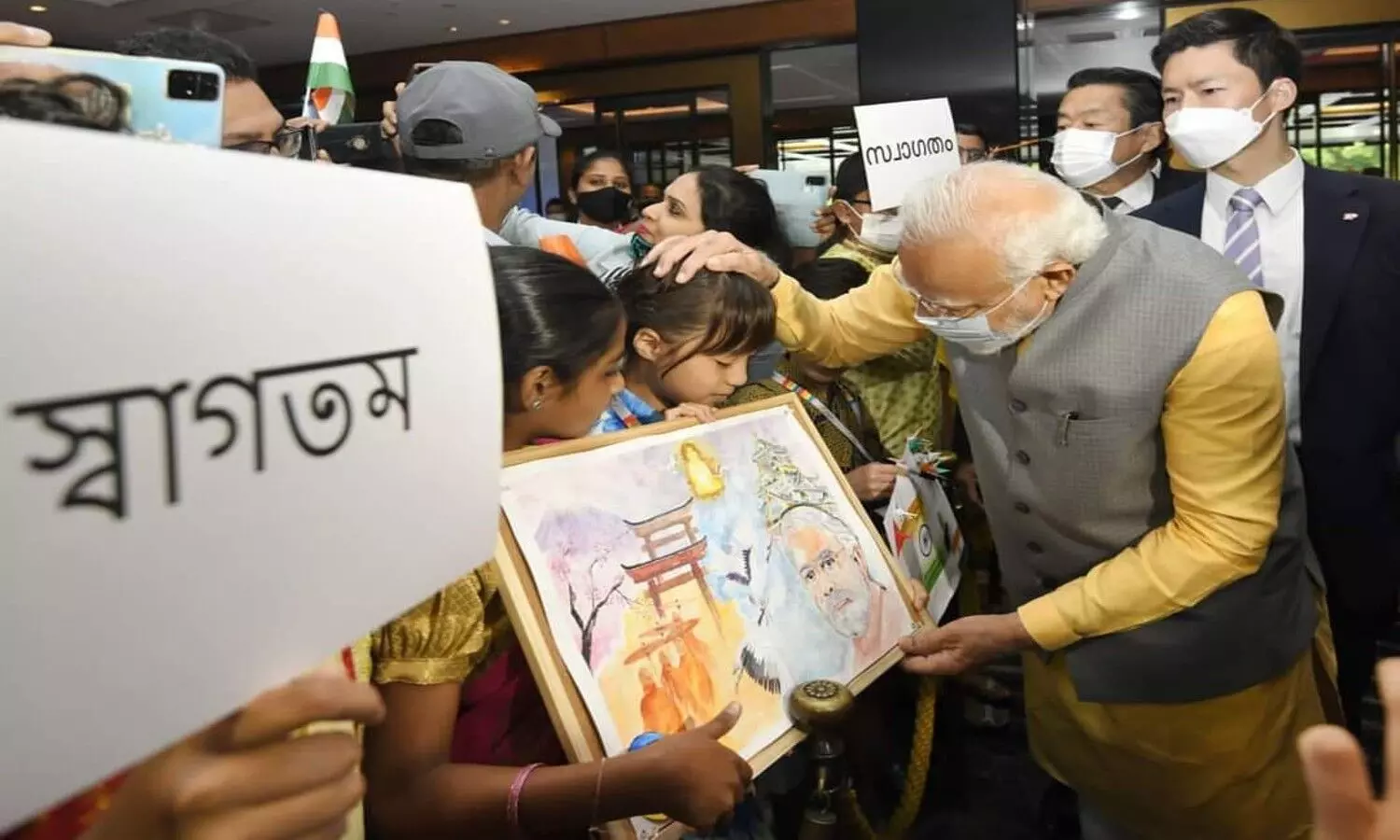 PM Modi meeting children in Tokyo