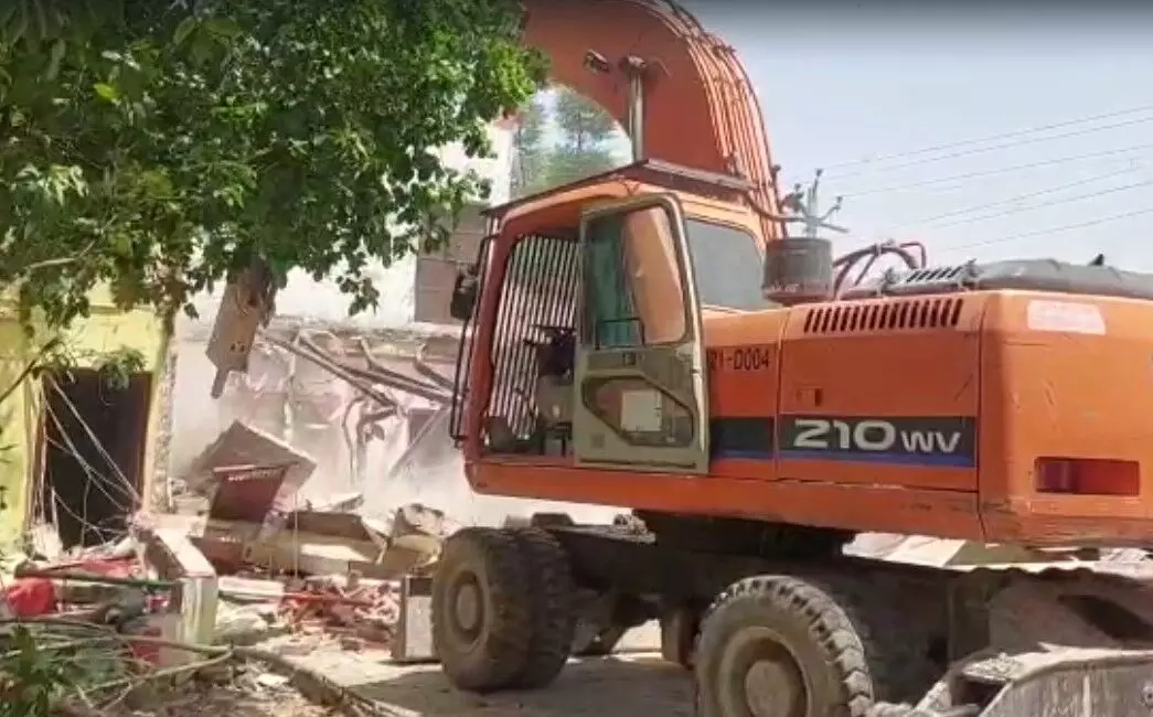 Bulldozer on illegal occupation in Etah
