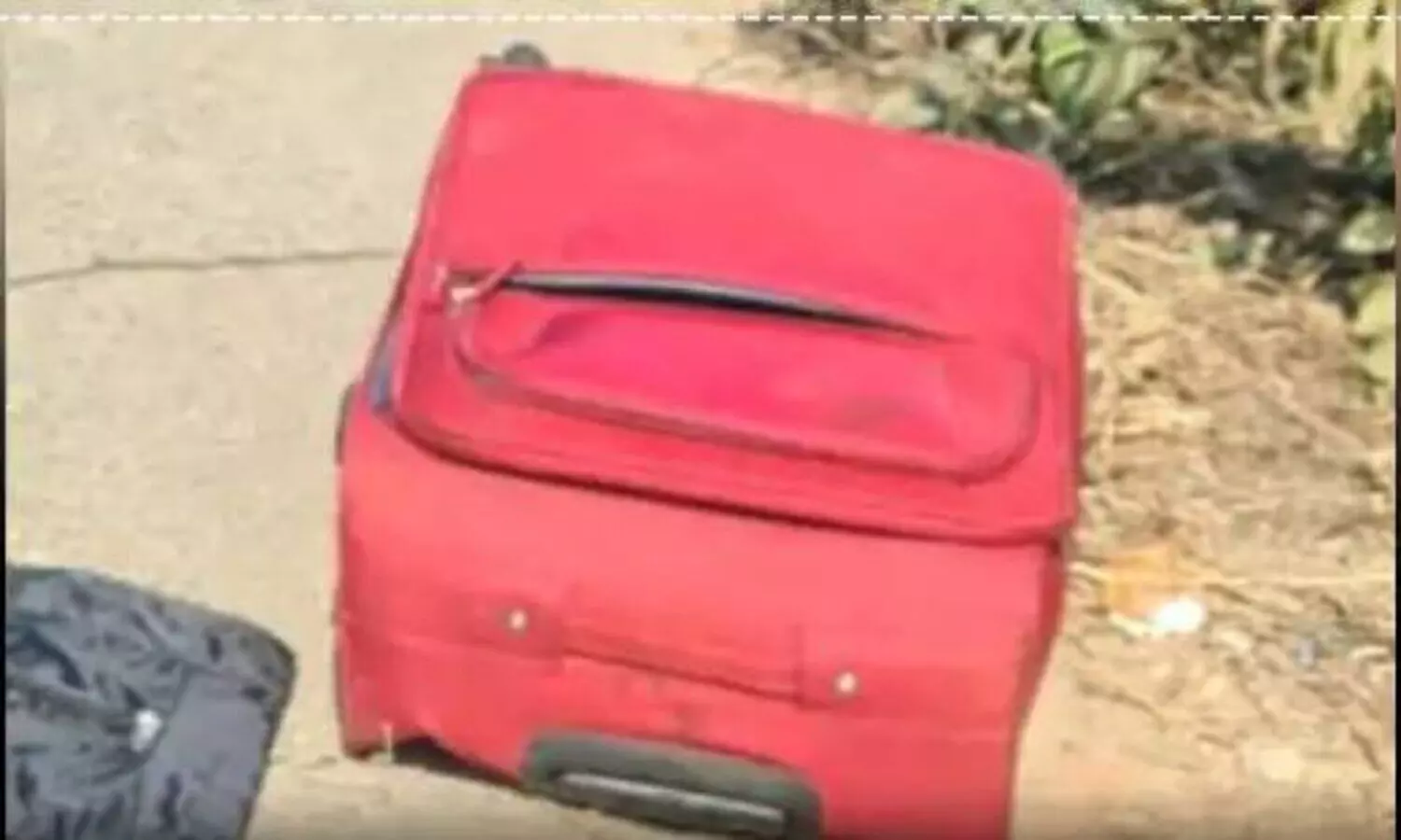 Dead body in red suitcase