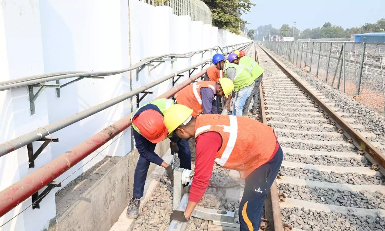 The work of laying third rail started in the depot premises for the operation of metro train.