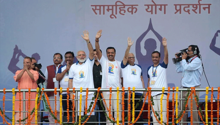 pm modi yoga poses on international yoga day in lucknow