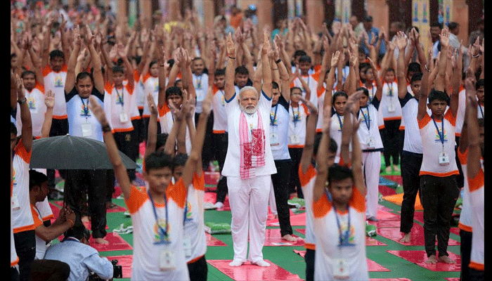 pm modi yoga poses on international yoga day in lucknow