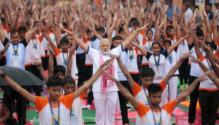 pm modi yoga poses on international yoga day in lucknow