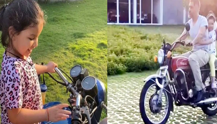 धोनी ने बेटी जीवा को बैठा कर दौड़ाई बाइक, तभी कड़कने लगी बिजली, देखें Video